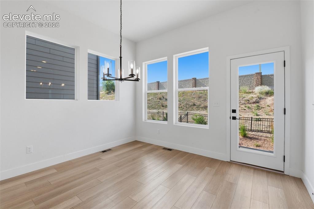 Image 9 of 31: Dining Space and backdoor exit