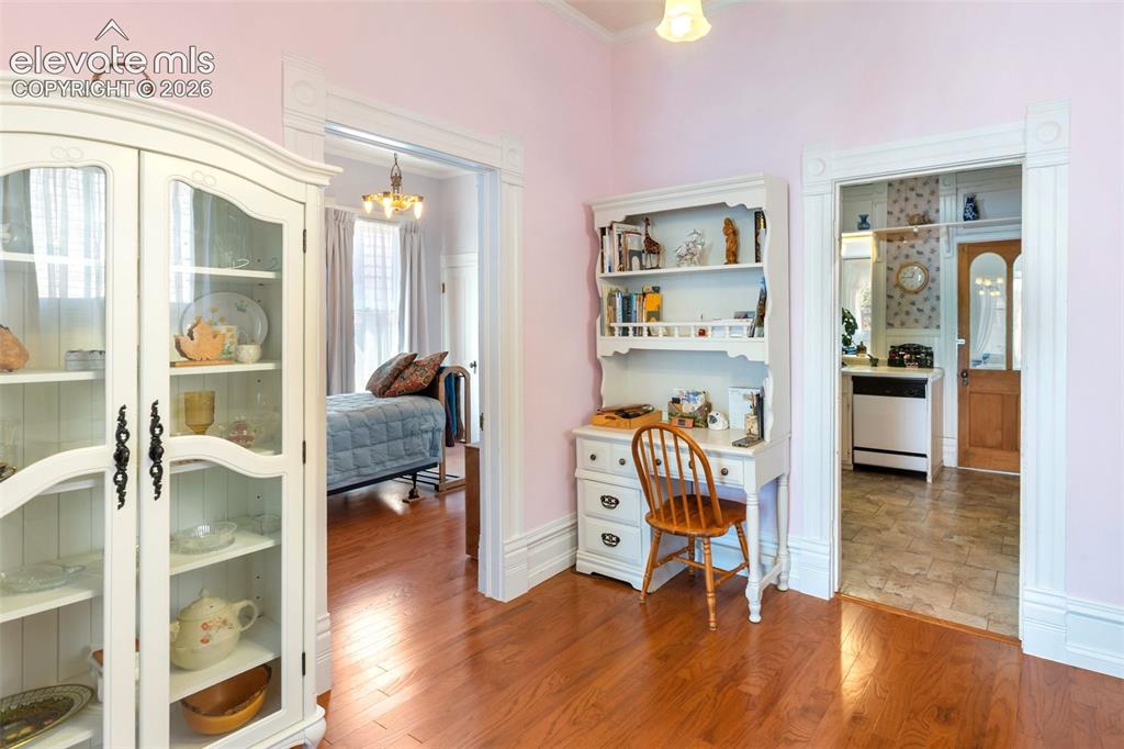 Image 13 of 29: Plenty of space for your China cabinet. An elegant space with wide trim tou