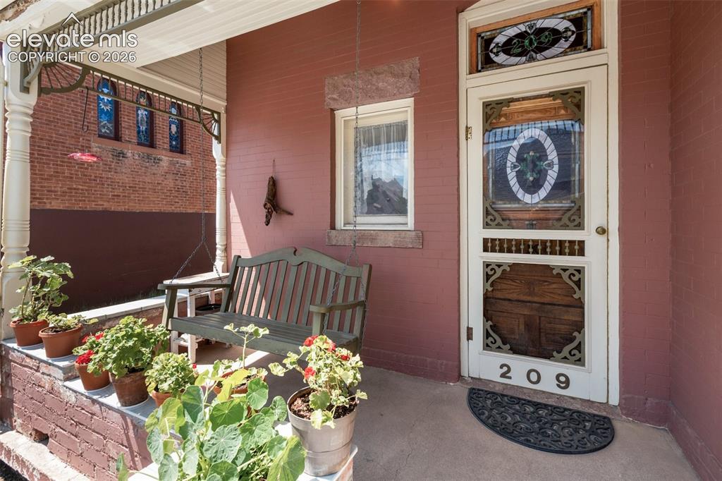 Image 3 of 29: Stained glass entry door. 