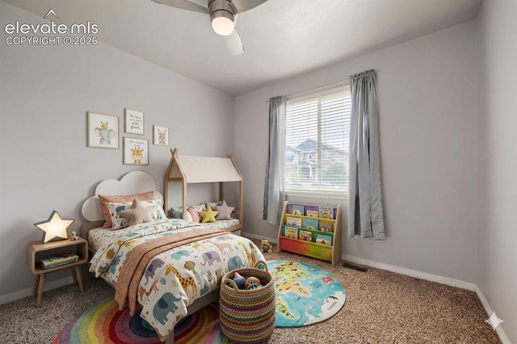 Image 18 of 41: Bright room featuring a window with blinds, a ceiling fan with integrated l