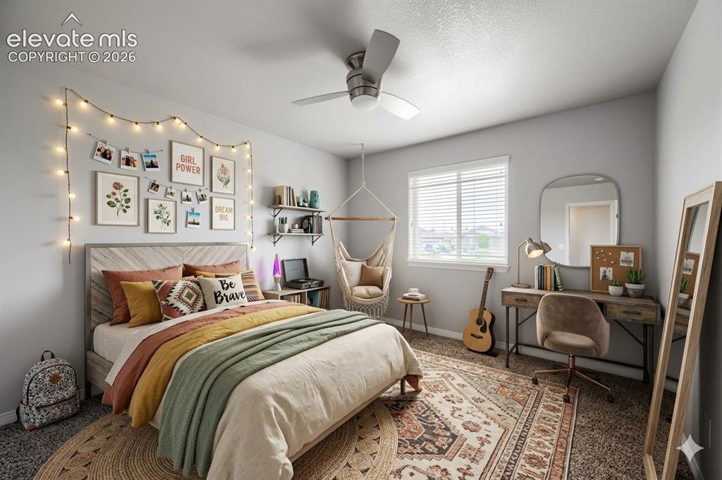 Image 22 of 41: Light gray walls with textured carpet, featuring a ceiling fan with light,