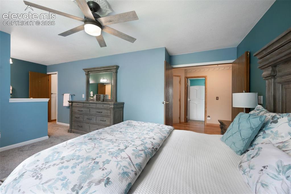 Image 19 of 50: Bedroom featuring baseboards, carpet floors, and ceiling fan
