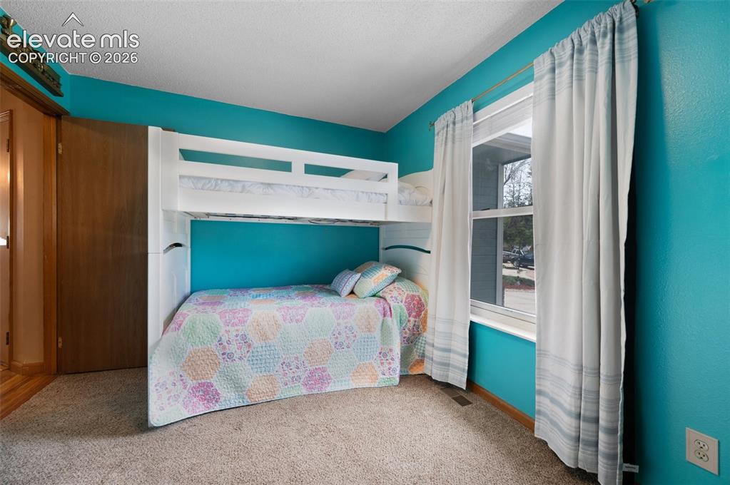 Image 24 of 50: View of carpeted bedroom