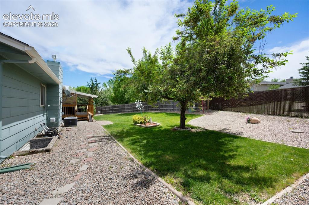 Image 47 of 50: View of yard with a patio and cooling unit