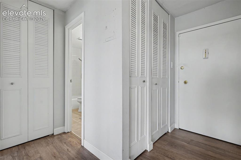 Image 2 of 25: Beautiful luxury vinyl flooring is found in the entryway and continues thro