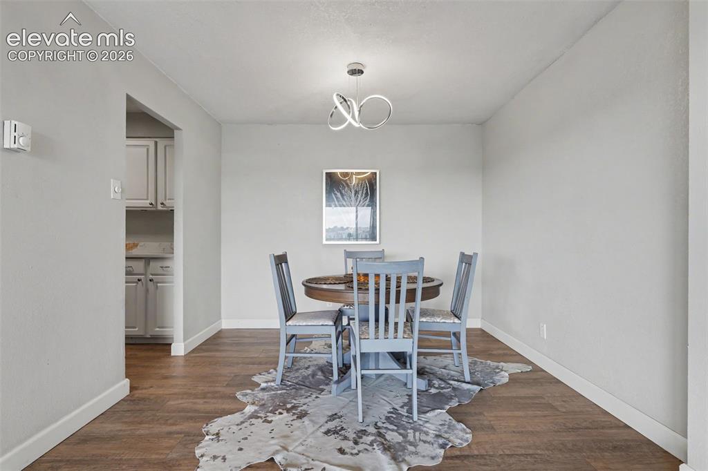 Image 8 of 25: The dining area is situated off the Living Room and showcases an impressive