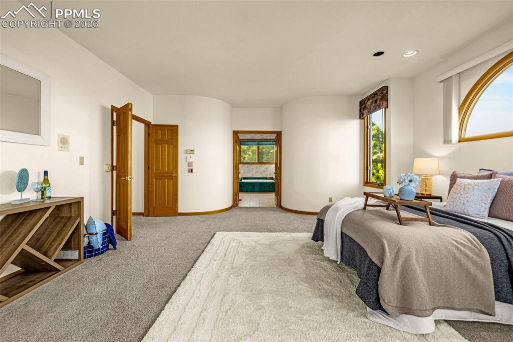 Image 24 of 47: Carpeted bedroom with baseboards and recessed lighting