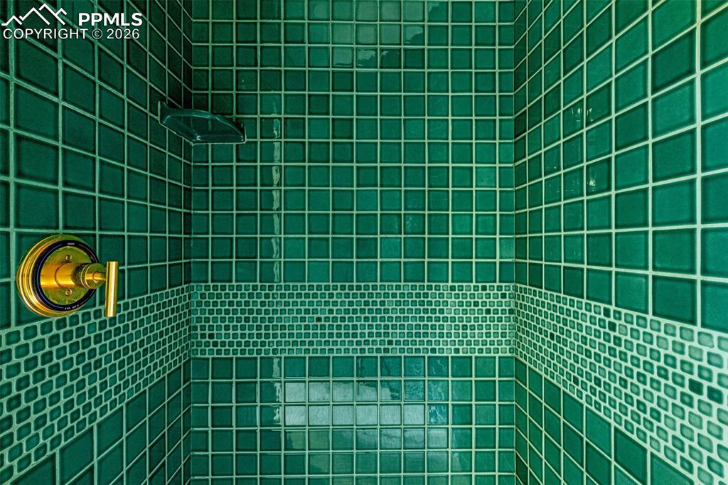 Image 30 of 47: Full bathroom with tiled shower