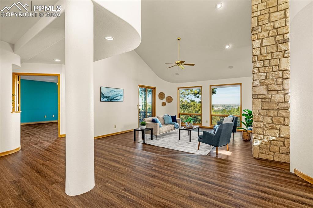 Image 6 of 47: Sitting room featuring dark wood-style floors, recessed lighting, vaulted c