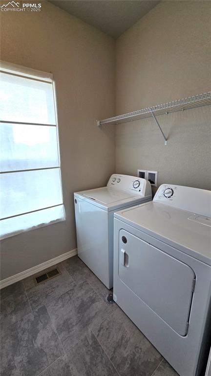 Image 17 of 29: Laundry room with washer and dryer.