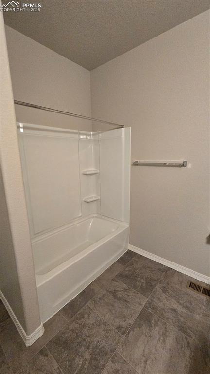 Image 22 of 29: Upper level bathroom with shower / bathtub combination.