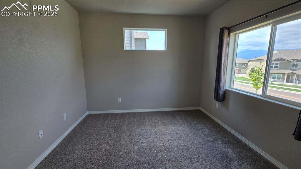 Image 23 of 29: Upper level bedroom