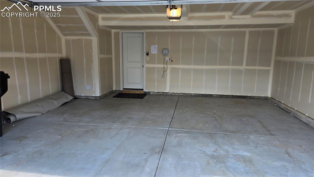 Image 29 of 29: 2 Car garage with a garage door opener