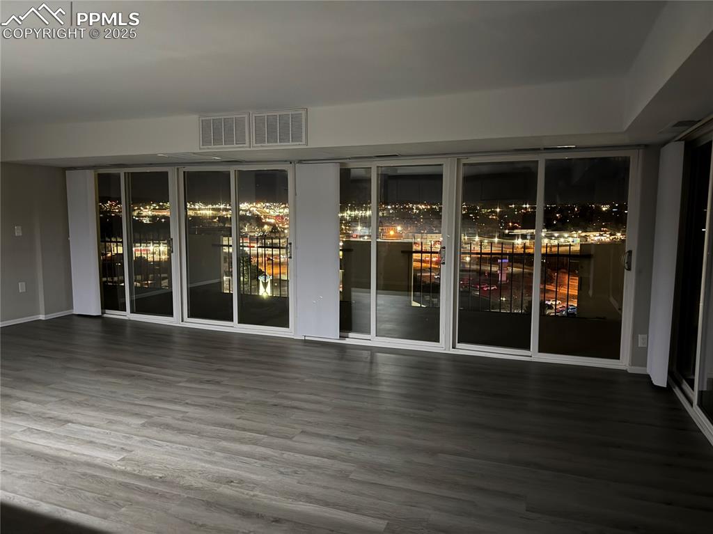 Image 40 of 44: Evening photo of the city from Living room