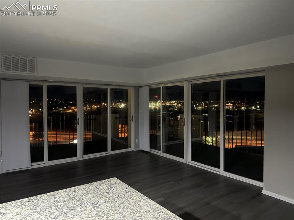 Image 41 of 44: Evening view in Dining room of city lights