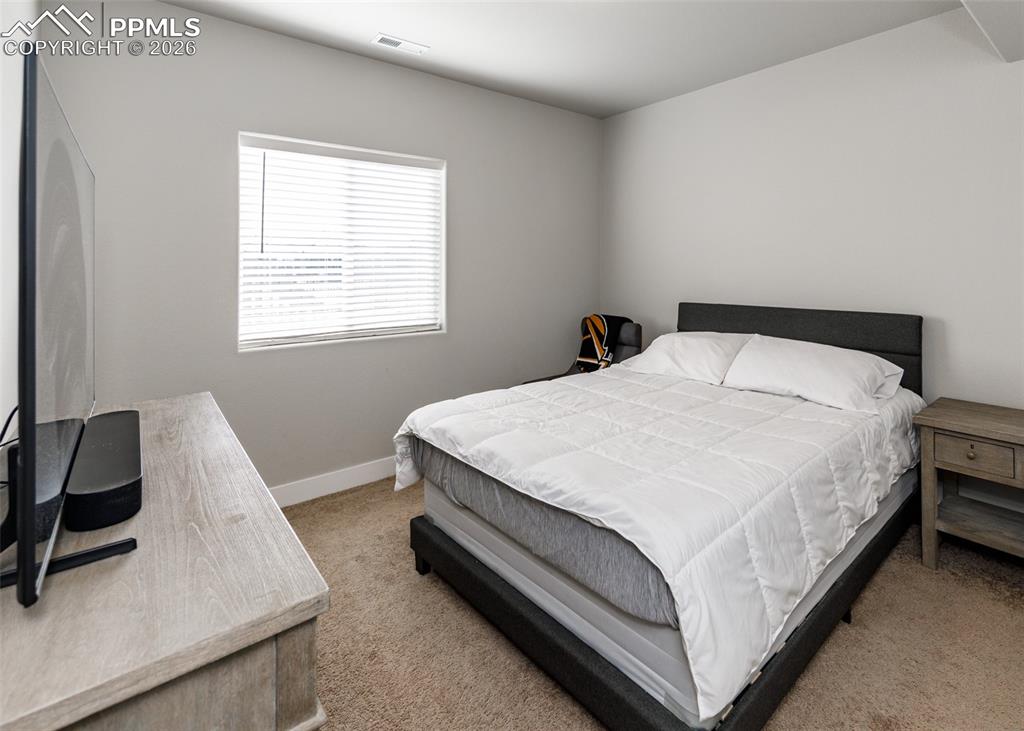 Image 47 of 50: Basement bedroom