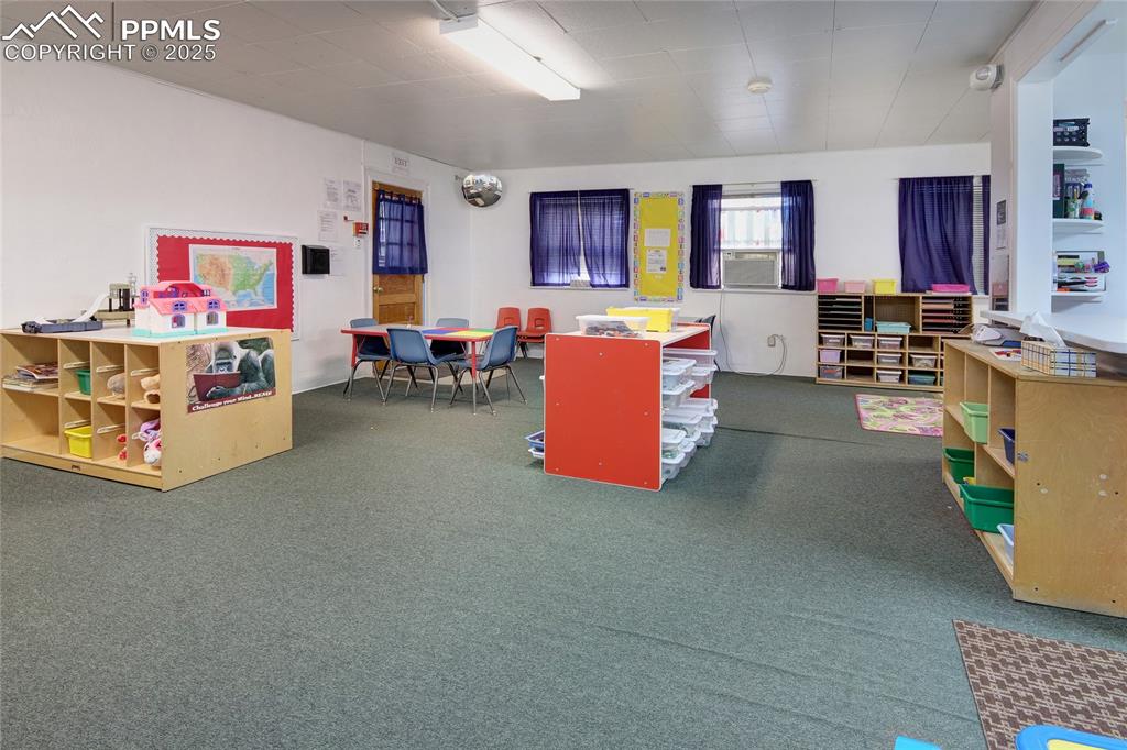 Image 13 of 34: Rec room featuring dark colored carpet