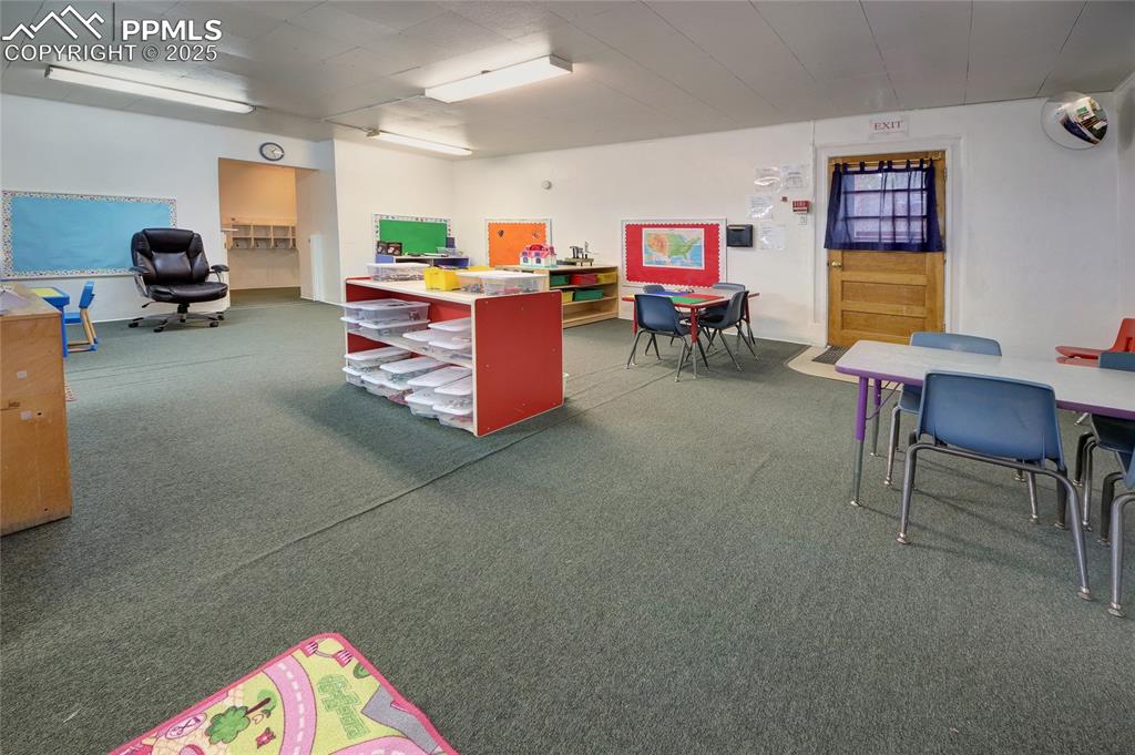 Image 16 of 34: Rec room with dark carpet