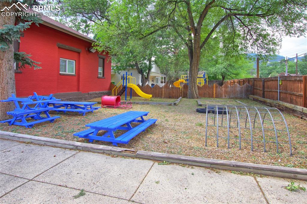 Image 26 of 34: View of yard with a playground and heating fuel