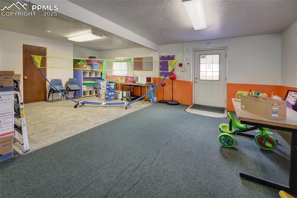 Image 7 of 34: Recreation room featuring carpet flooring