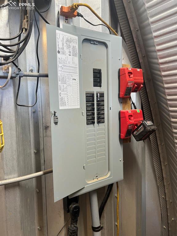 Image 11 of 31: Utilities featuring electric panel