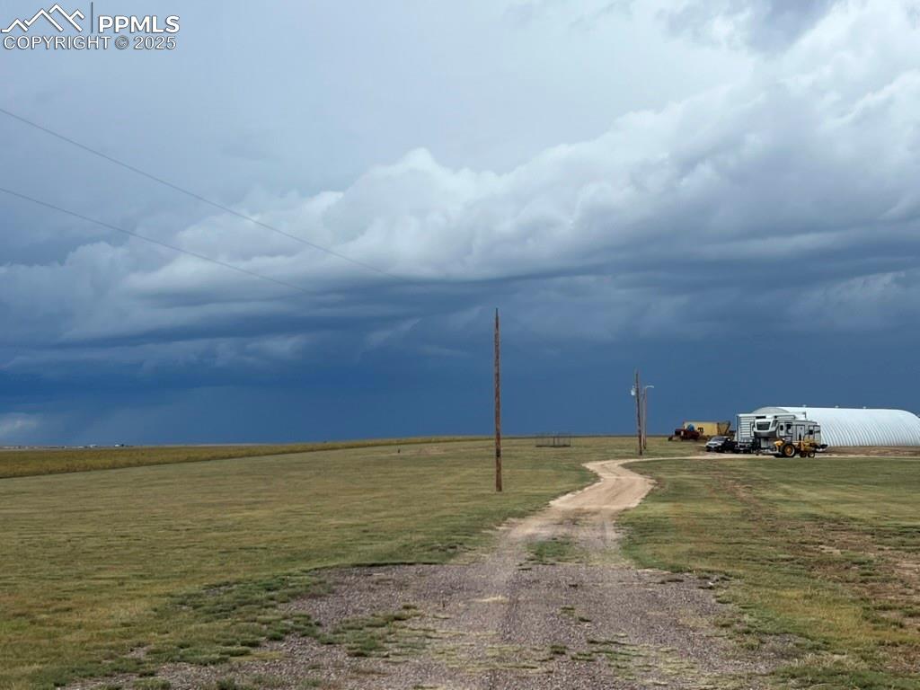 Image 19 of 31: View of dirt / gravel road featuring a view of rural / pastoral area