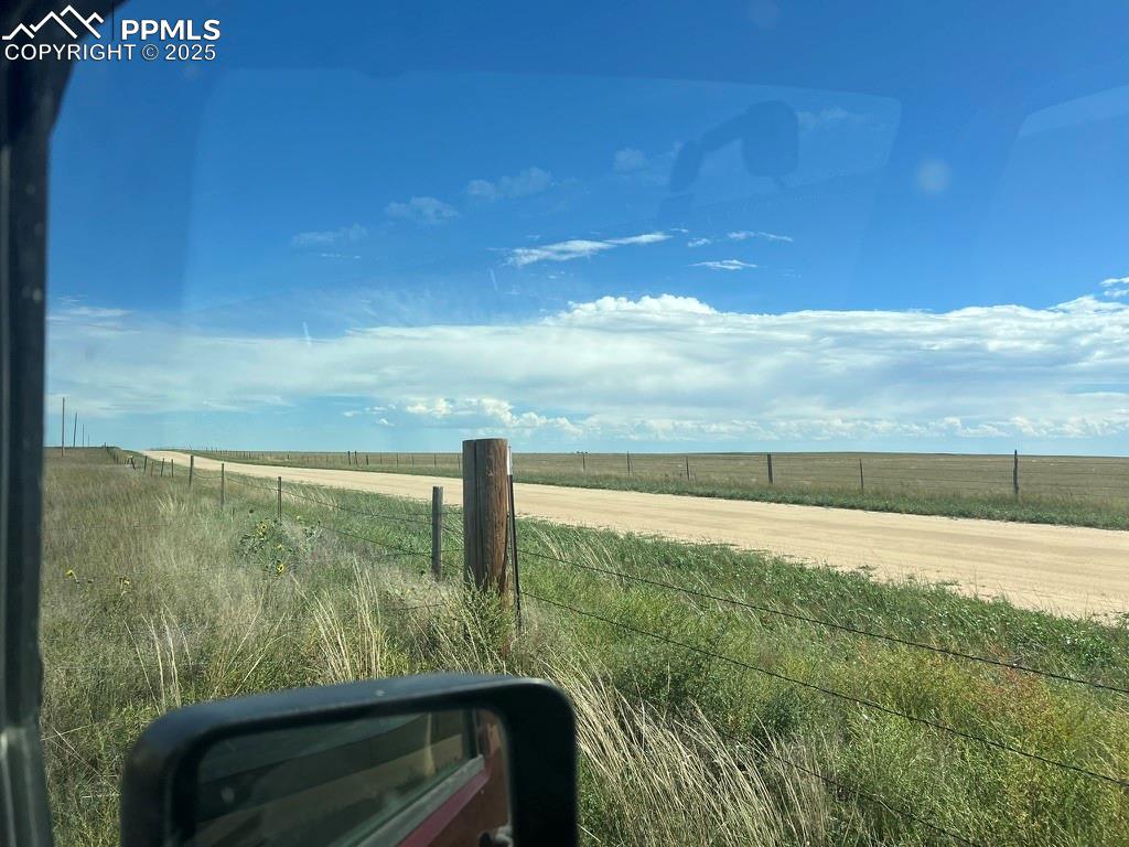 Image 29 of 31: View of dirt / gravel road with a view of countryside
