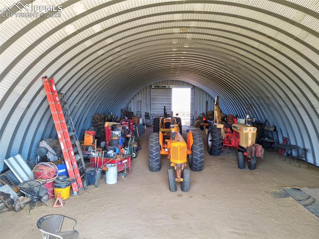 Image 7 of 31: Misc room featuring vaulted ceiling