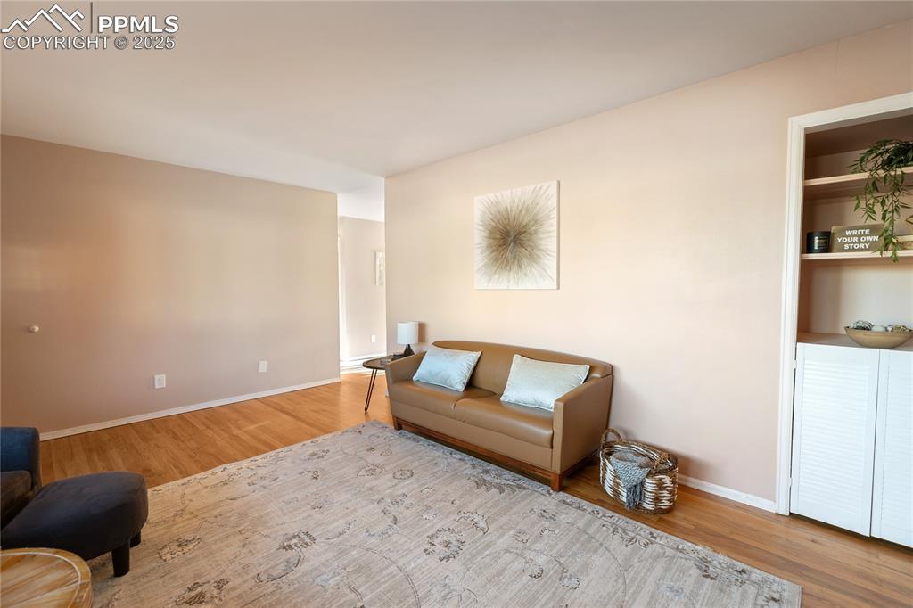 Image 12 of 38: Living room features built-in storage.