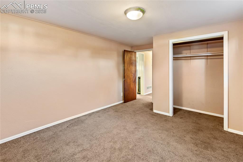 Image 30 of 38: 4th bedroom is located in the basement