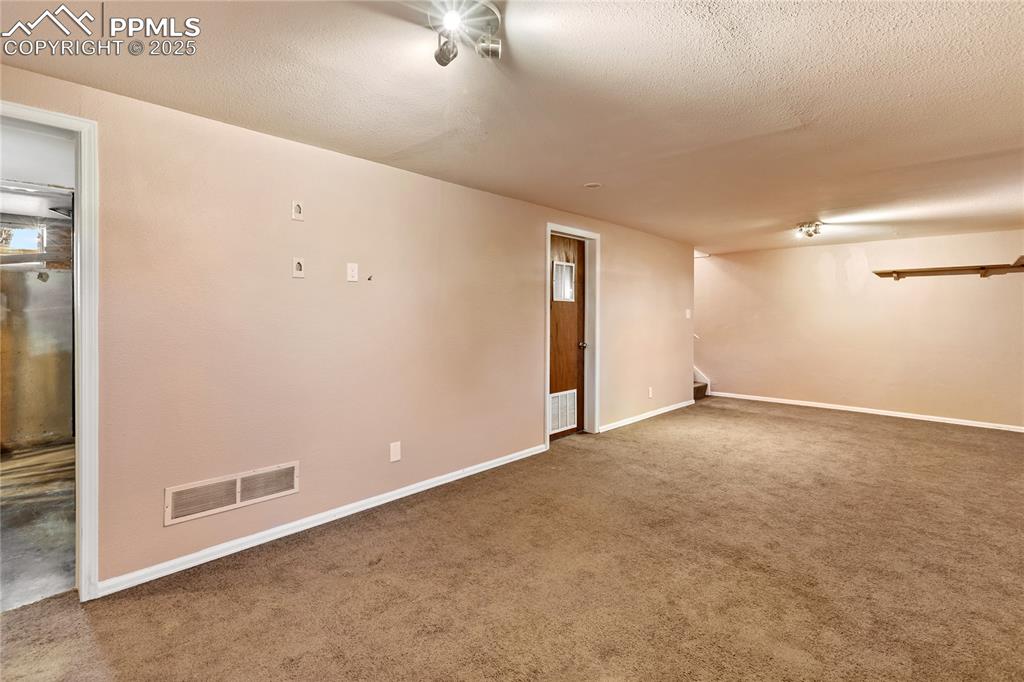 Image 31 of 38: Spacious basement family room