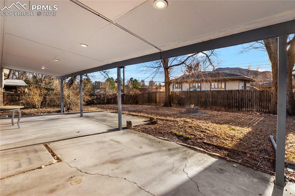 Image 4 of 38: Covered patio with mountain views