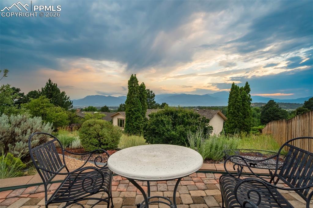 Image 48 of 50: Summer photo of upper patio overlooking the mountain range