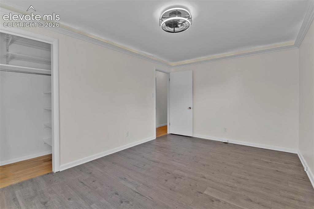 Image 21 of 40: Large Mudroom off the carport and garage with built in organization system.
