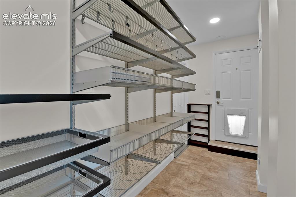 Image 22 of 40: Basement Family Room with closets for storage. 4