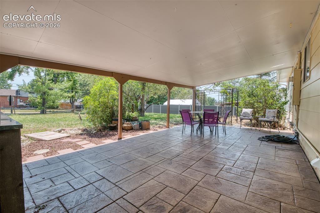 Image 36 of 40: Large corner lot - fully fenced, mature fruit trees, two large storage shed