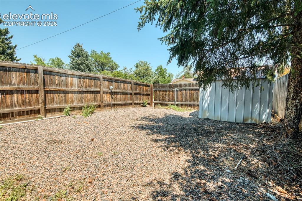 Image 42 of 45: Fenced RV paddock with storage shed and easy street access.