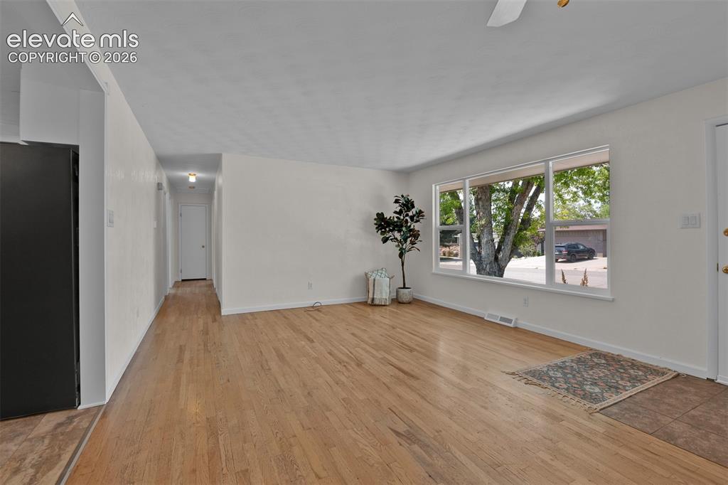 Image 8 of 40: Opposite view of the Living room. Door to the left leads to the large mudro
