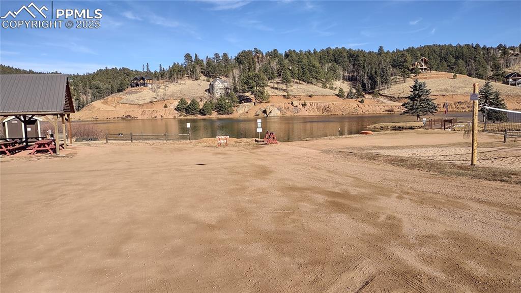 Image 39 of 42: Burgess Lake clubhouse, pavilion, and volleyball area.