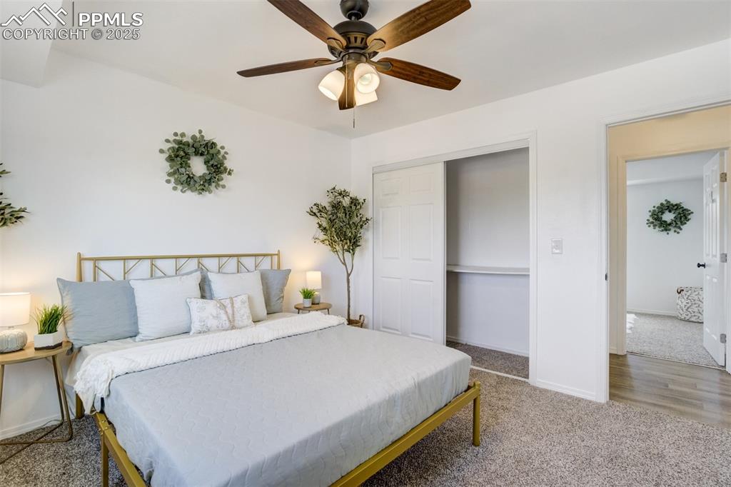 Image 14 of 33: Bedroom featuring carpet floors, a closet, and ceiling fan