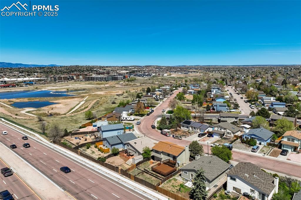 Image 30 of 33: Aerial perspective of suburban area featuring mountains