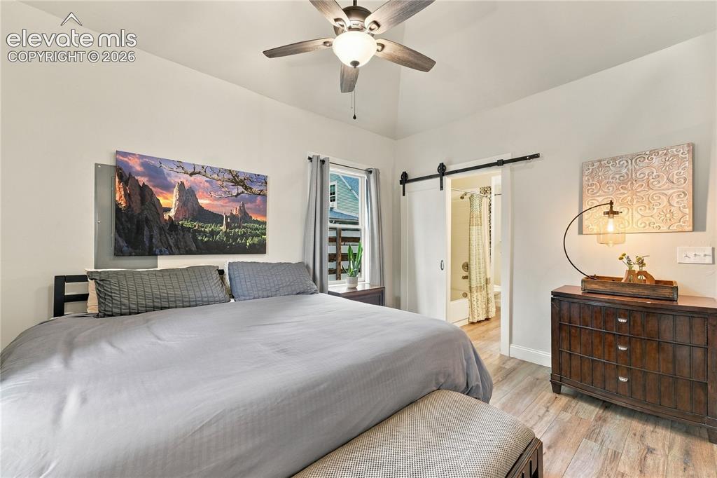 Image 38 of 50: Opposite view of the bedroom suite with high ceilings.