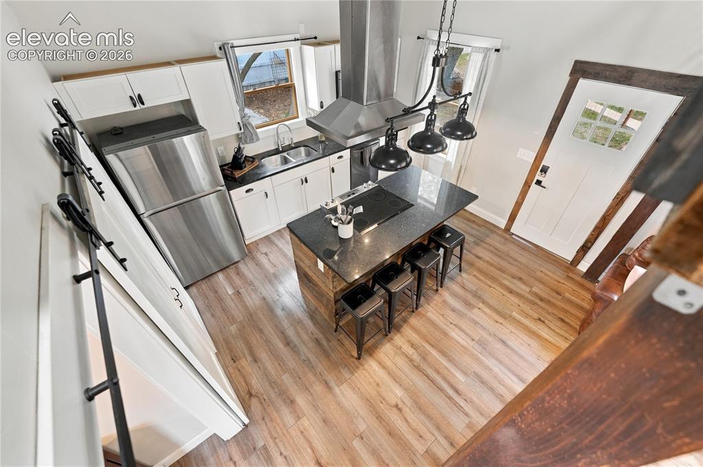 Image 43 of 50: View from the loft into the kitchen.