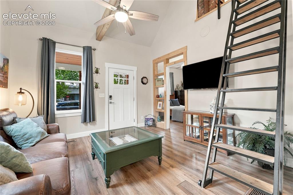 Image 6 of 50: View from kitchen into living room and entry.