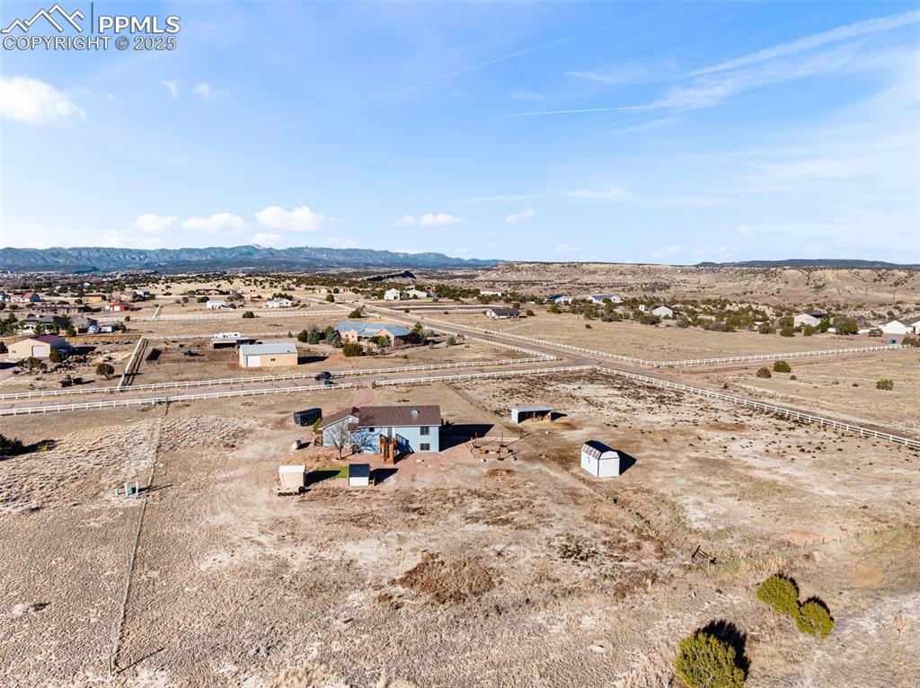 Image 32 of 41: View of rural area featuring a desert landscape and mountains