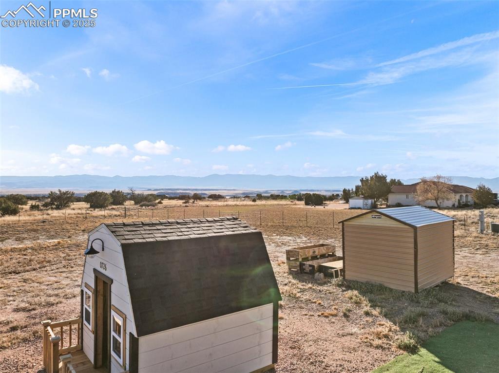 Image 39 of 41: View of shed with a view of rural / pastoral area and a mountain view