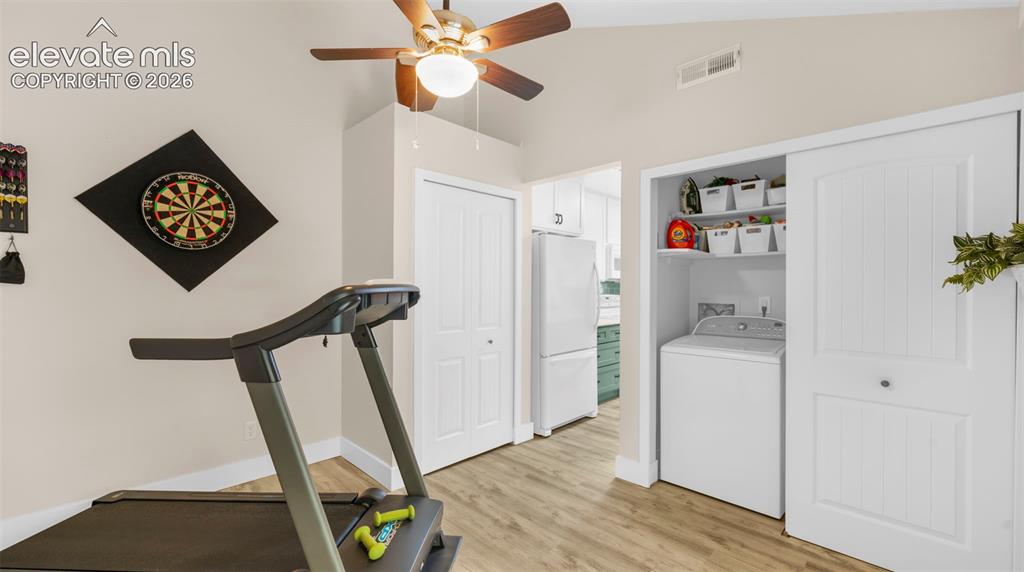 Image 22 of 37: Vaulted ceilings featuring a ceiling fan with integrated lighting