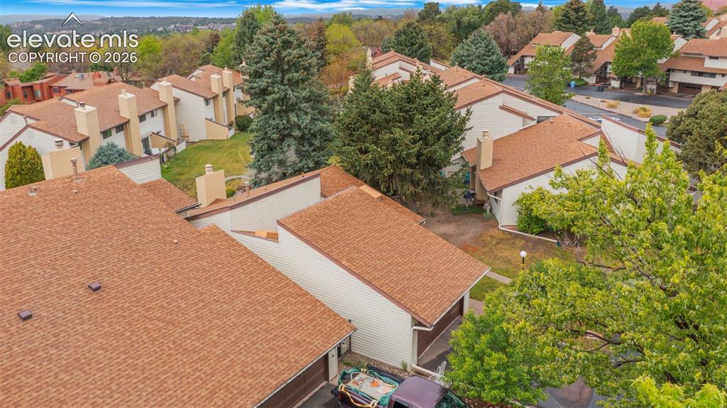 Image 27 of 37: Aerial perspective showcasing a residential community with numerous townhom