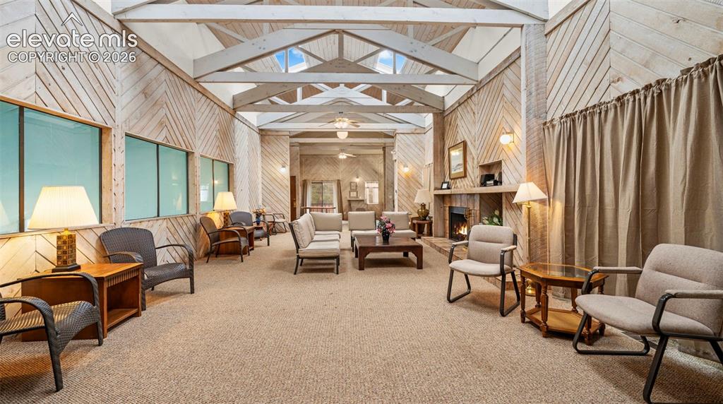 Image 28 of 37: Vaulted ceiling with exposed wood beams