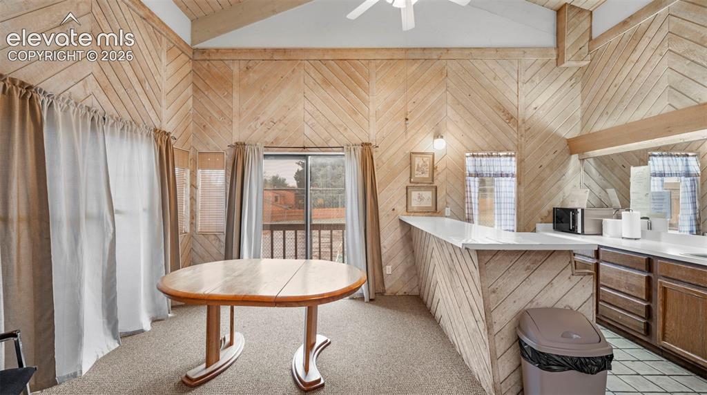 Image 30 of 37: Vaulted wood-paneled ceilings with exposed beams, wood-finish wall paneling